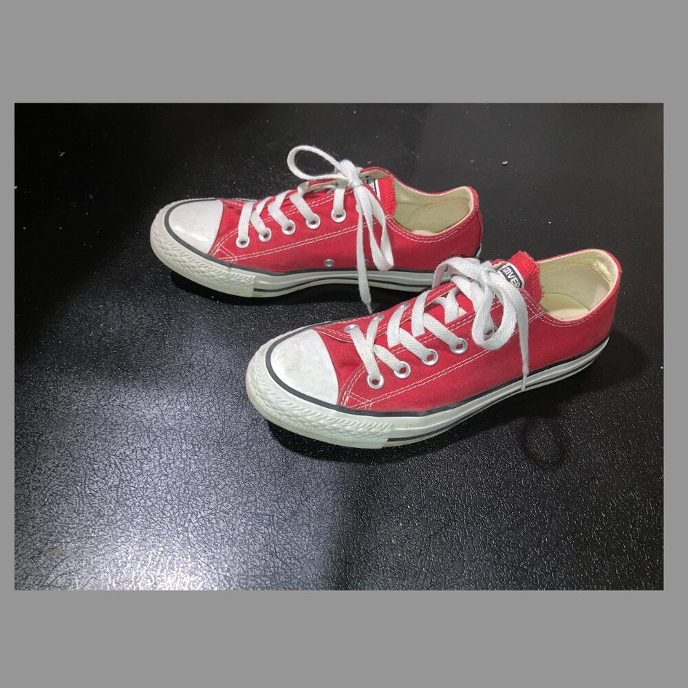 Red canvas Converse Chuck Taylor All Star low top sneakers